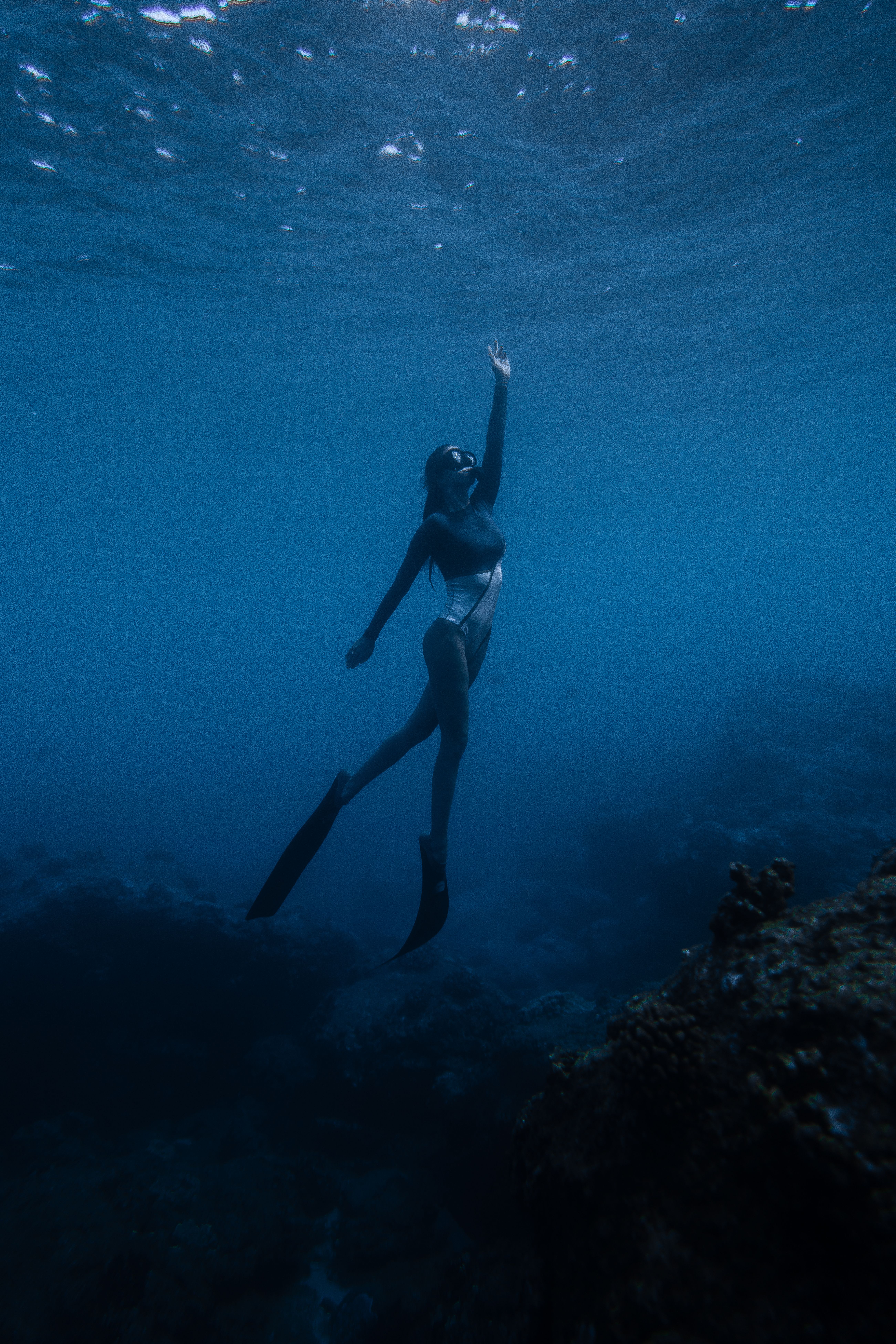 Woman diving in ocean