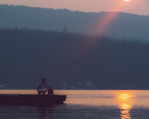 Woman reflecting on a mid-career change while sitting
